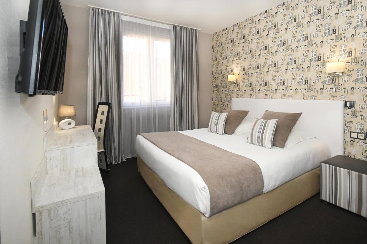 Logis Hotel Du Centre - Halte Ideale En Cyclotourisme Avec Garage A Velos Clos โมลไชม์ ภายนอก รูปภาพ